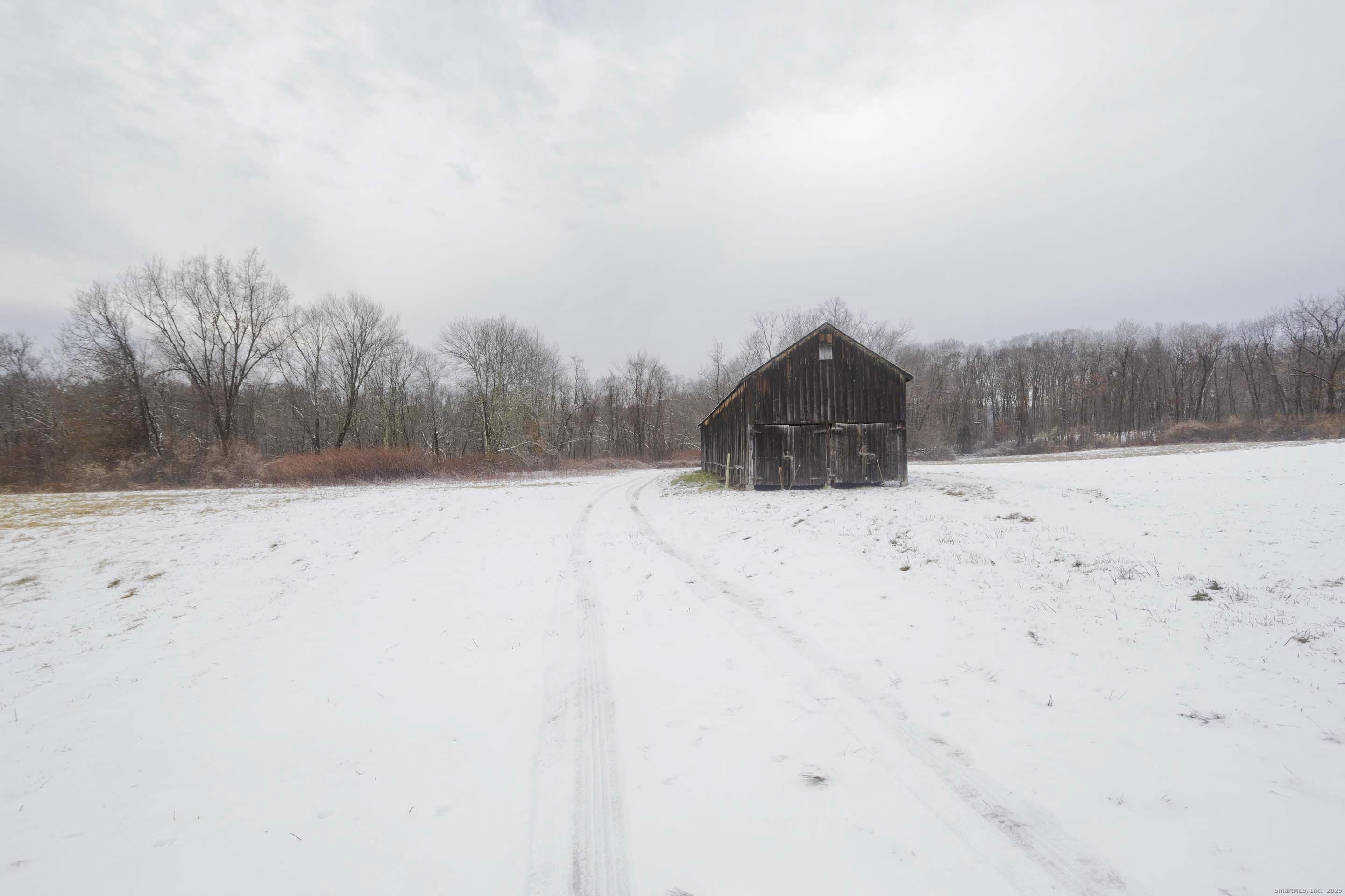 1095 South Grand Street Suffield, CT 06093 - Photo 24 of 31 a view of a snow in the yard