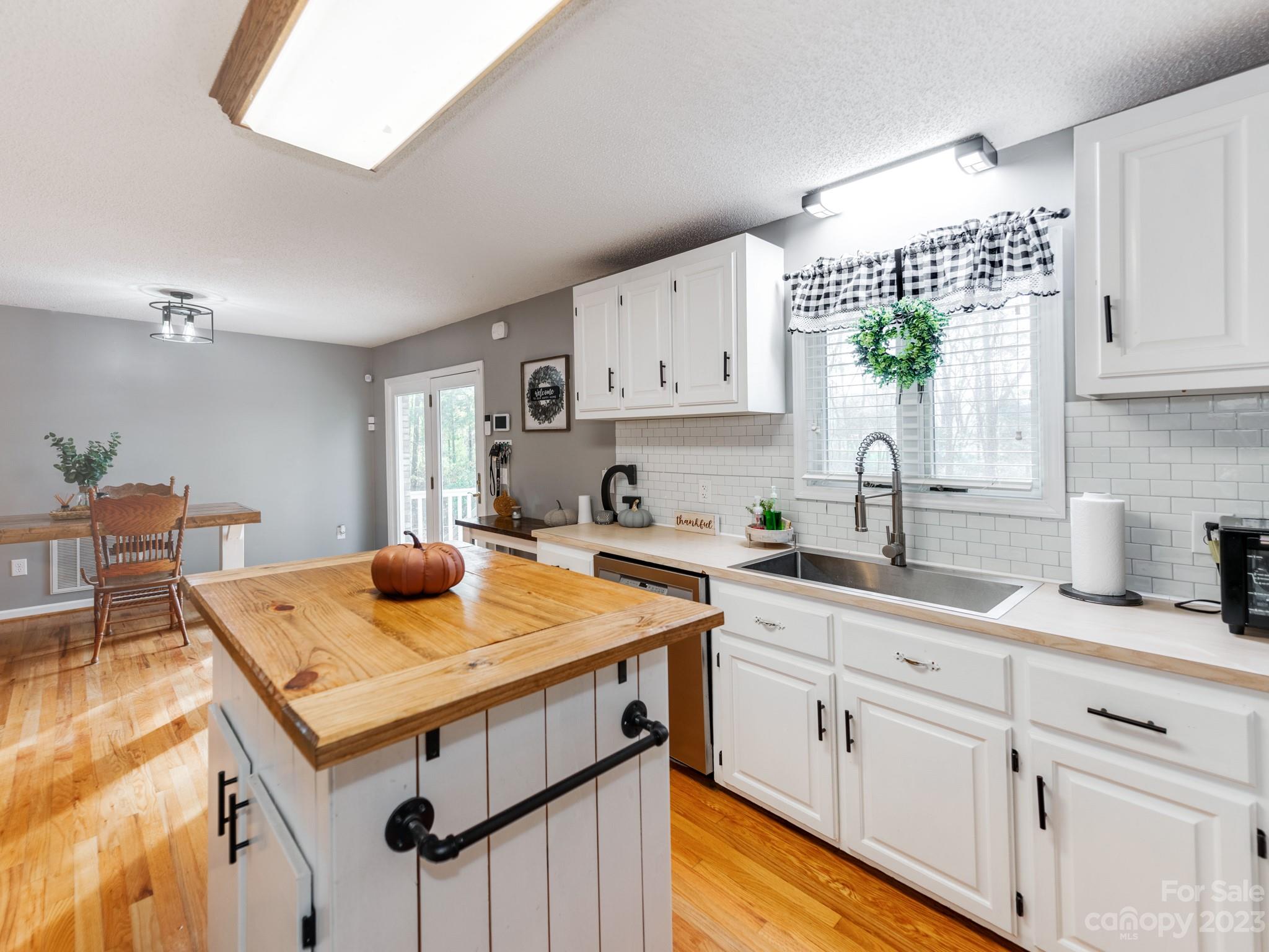 33702 Western Road Albemarle, NC 28001 - Photo 16 of 42 a kitchen with appliances cabinets and a counter top space