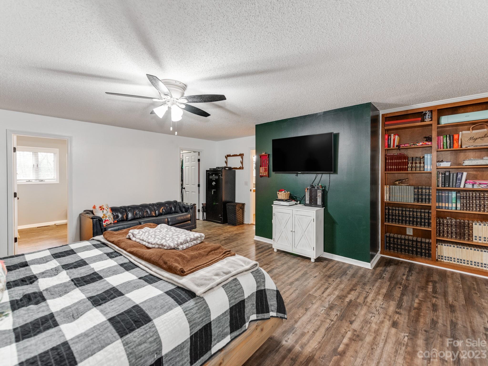 33702 Western Road Albemarle, NC 28001 - Photo 18 of 42 a bedroom with a bed and a flat screen tv