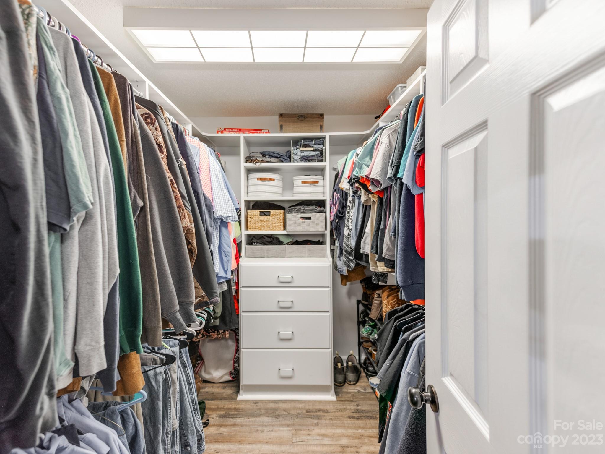 33702 Western Road Albemarle, NC 28001 - Photo 21 of 42 a view of walk in closet with clothes