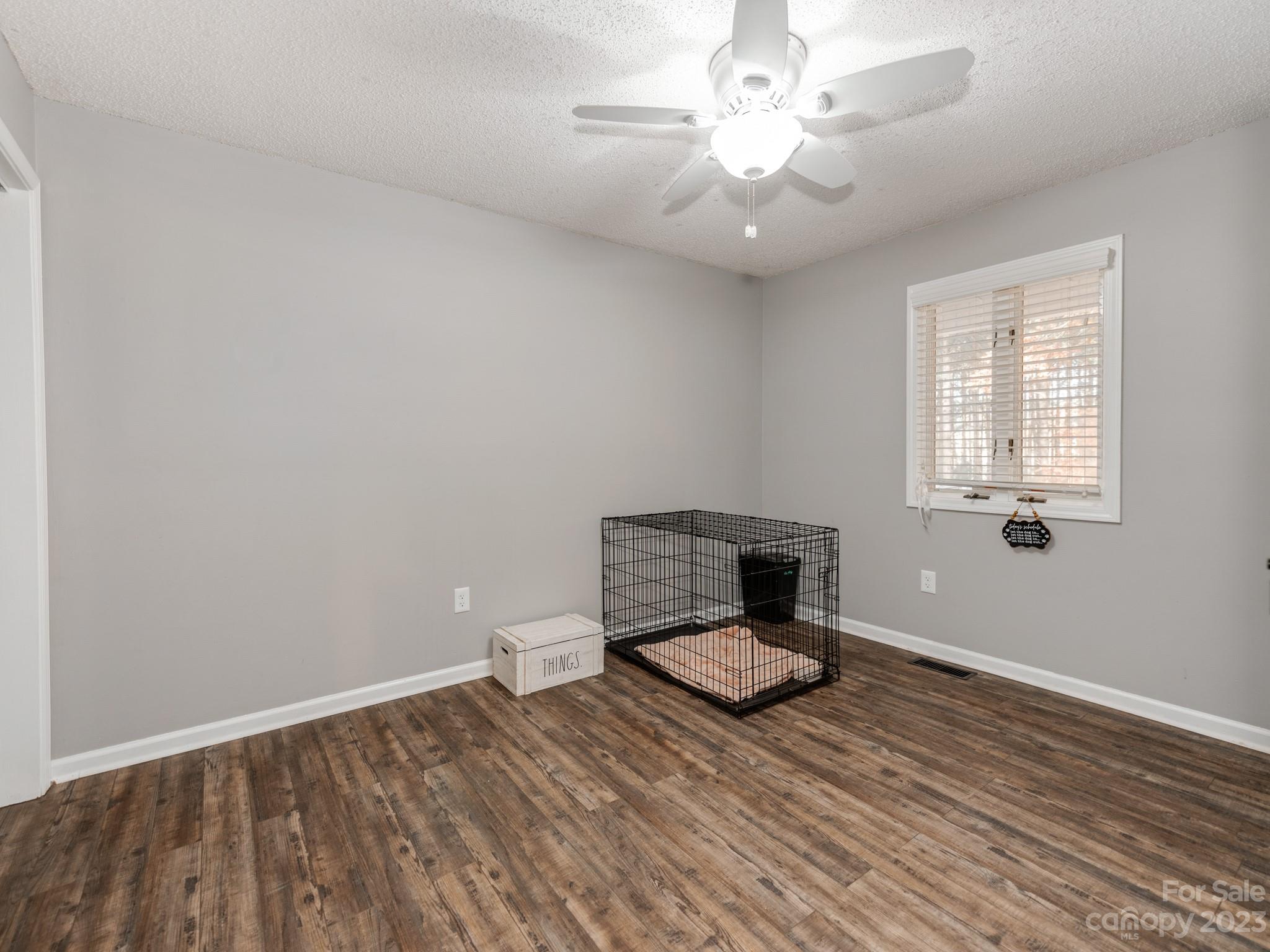 33702 Western Road Albemarle, NC 28001 - Photo 24 of 42 wooden floor in an empty room with a window