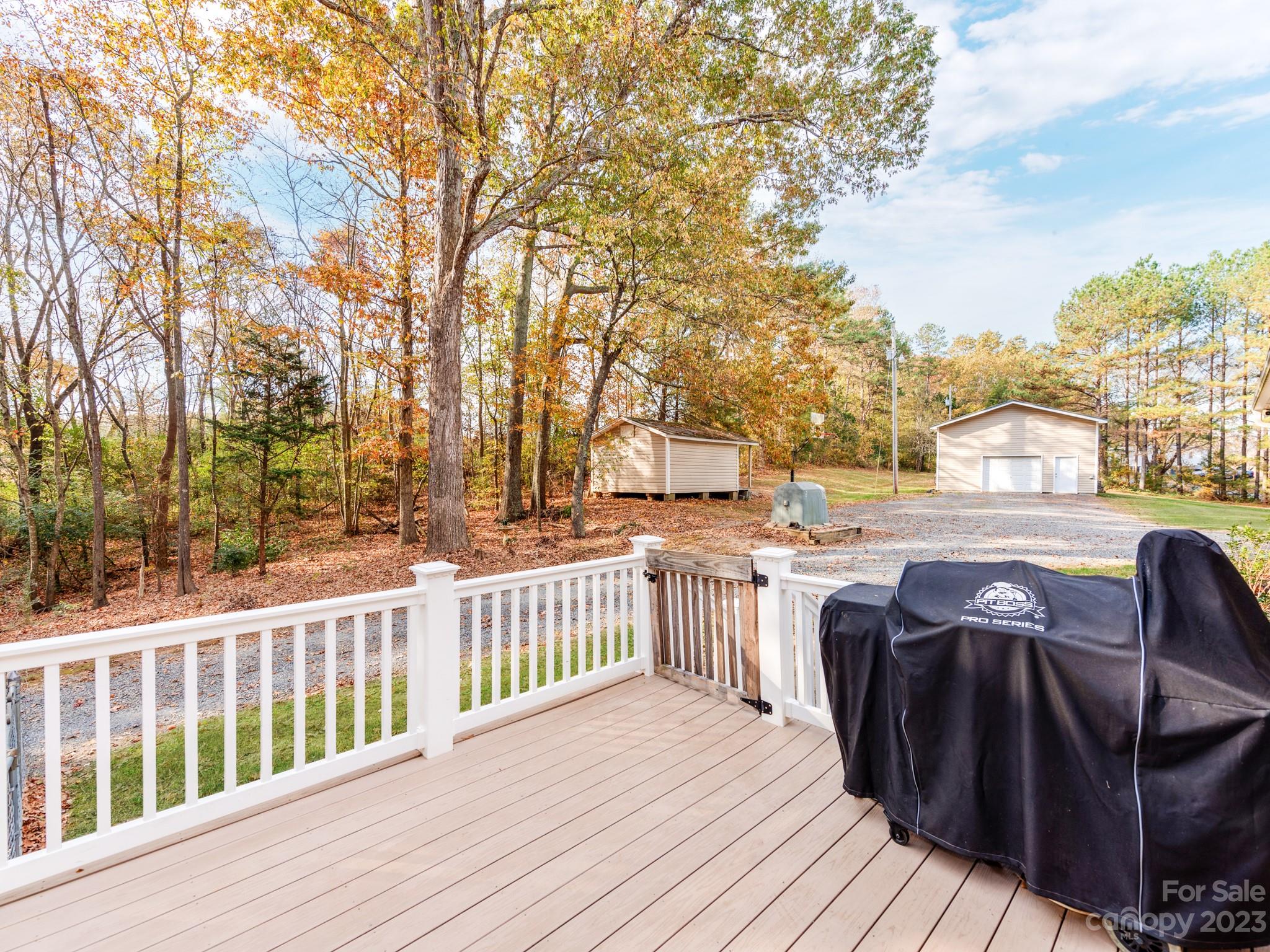 33702 Western Road Albemarle, NC 28001 - Photo 34 of 42 a view of a wooden chairs on roof deck