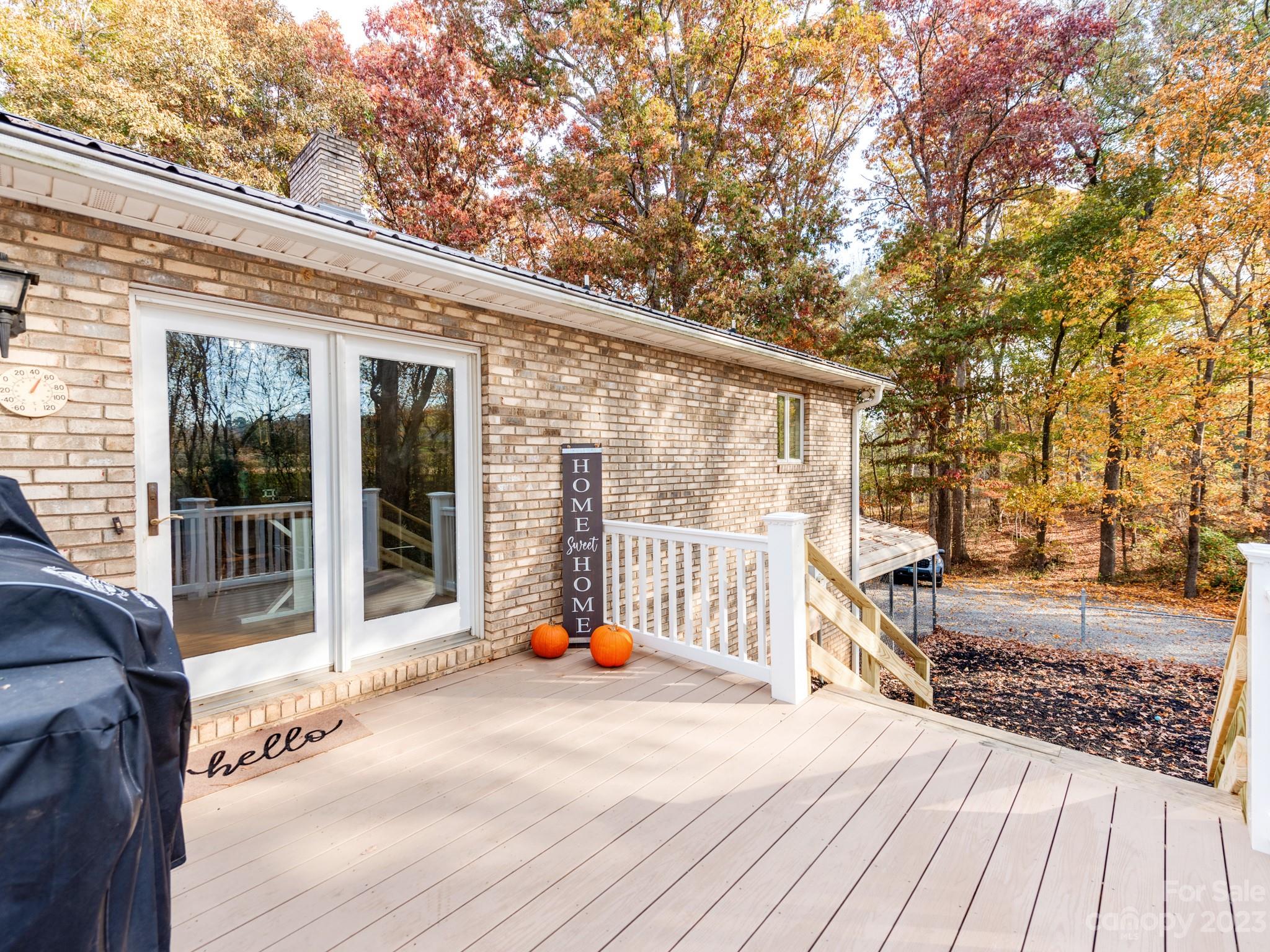 33702 Western Road Albemarle, NC 28001 - Photo 35 of 42 a view of a patio with wooden floor and iron stairs