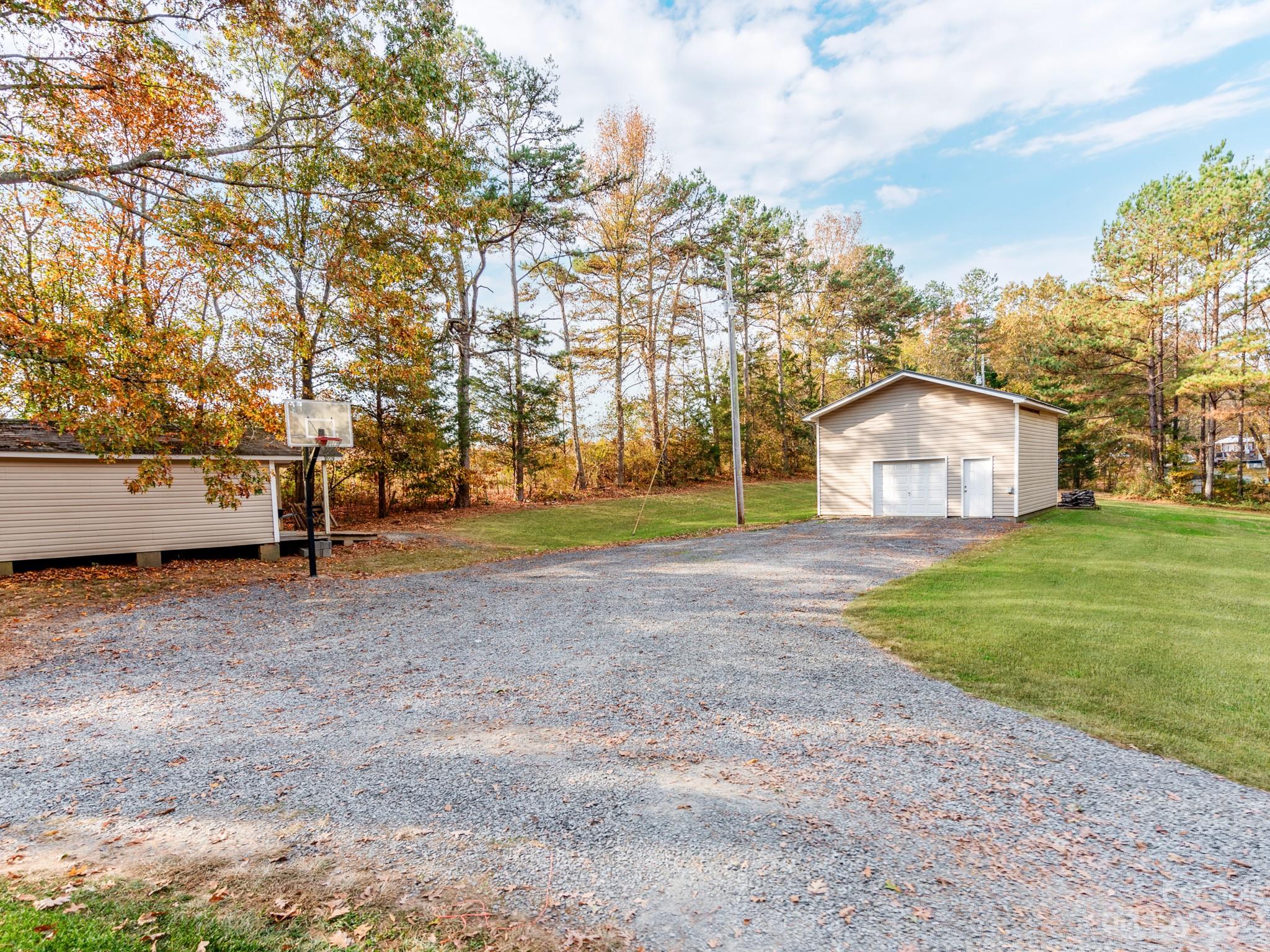 33702 Western Road Albemarle, NC 28001 - Photo 37 of 42 a view of yard with tree and car parked