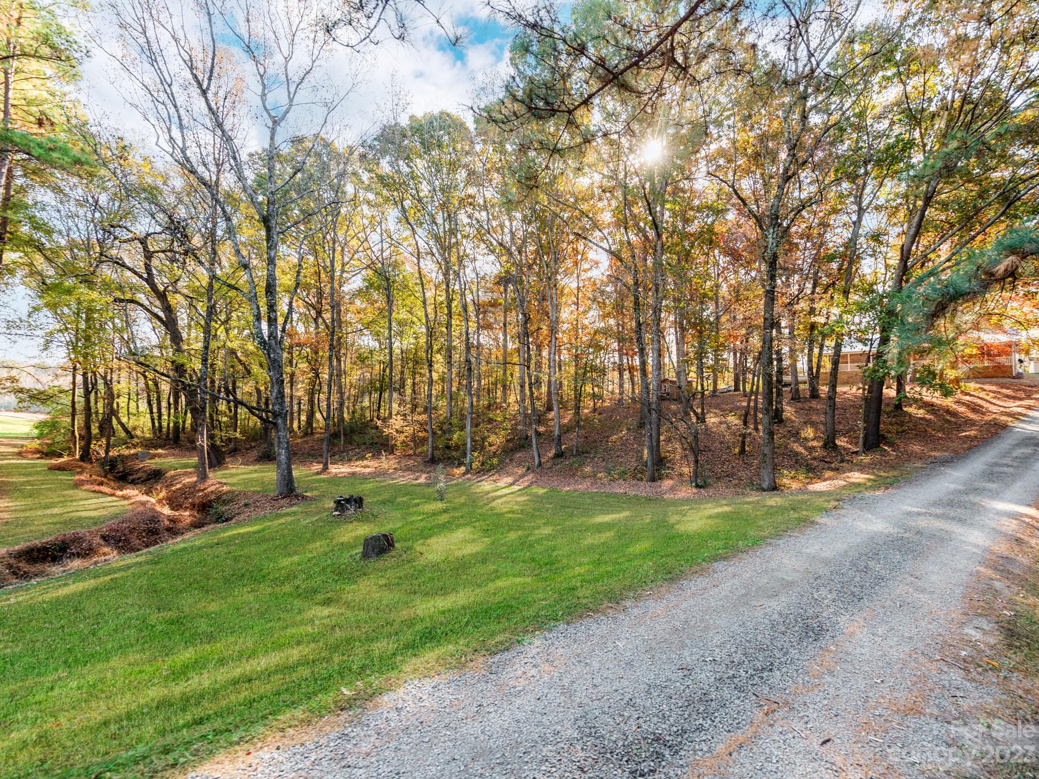 33702 Western Road Albemarle, NC 28001 - Photo 4 of 42 a backyard of a house with lots of green space