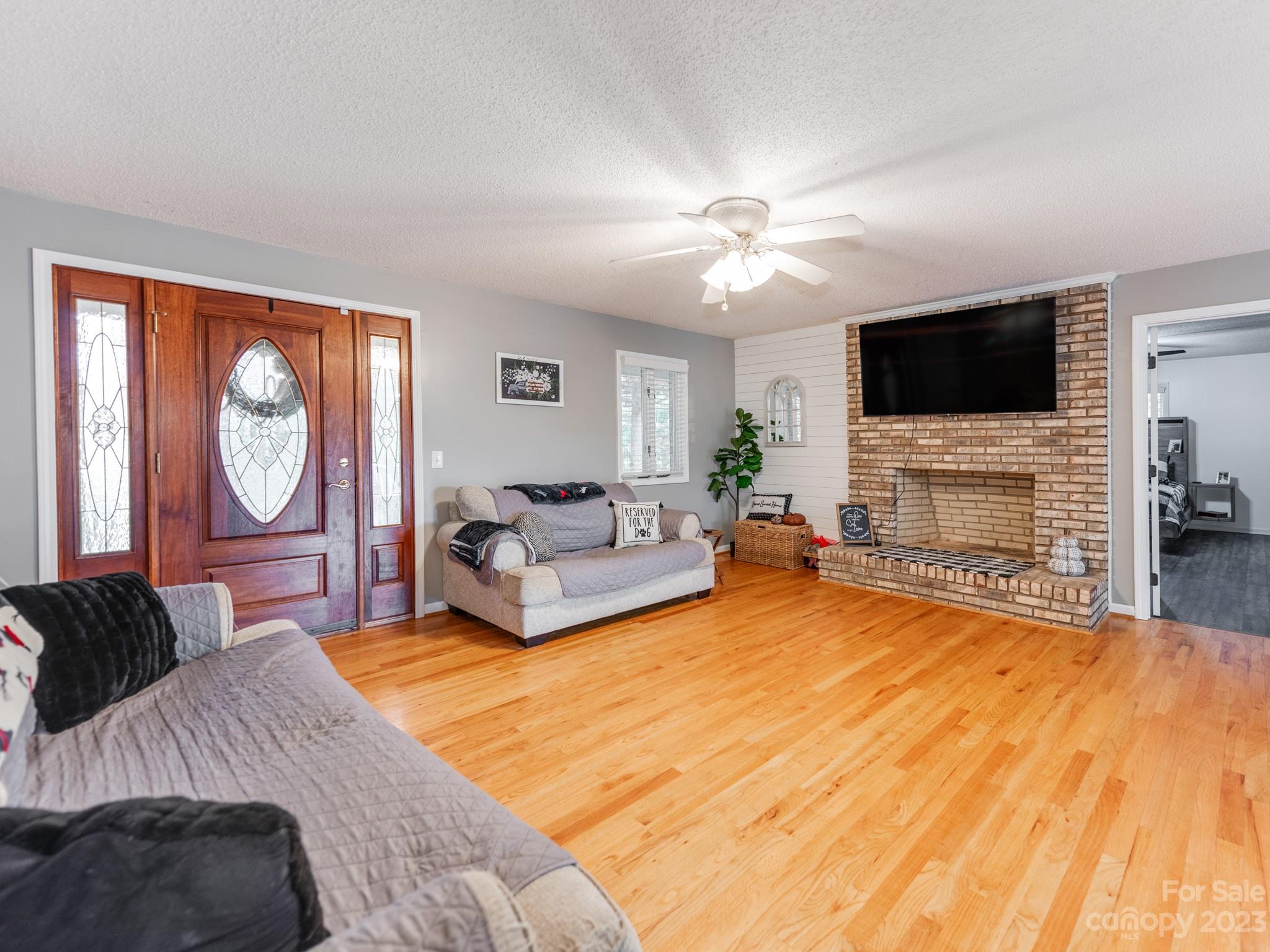 33702 Western Road Albemarle, NC 28001 - Photo 10 of 42 a spacious bedroom with a bed and a flat screen tv