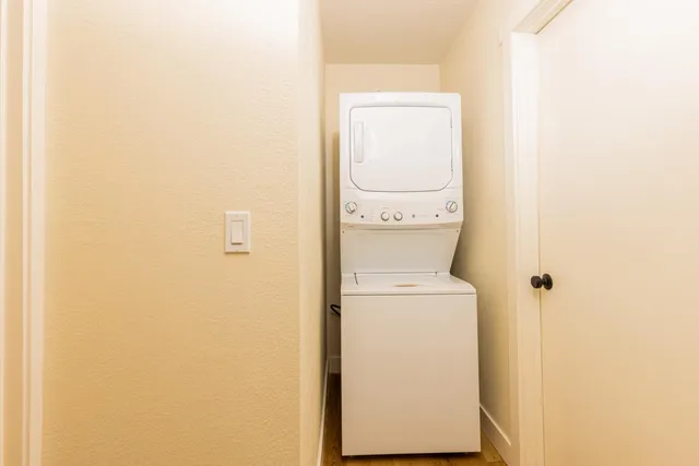 a kitchen with stainless steel appliances a stove a sink and a refrigerator