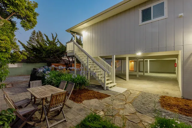 an aerial view of residential houses with city view