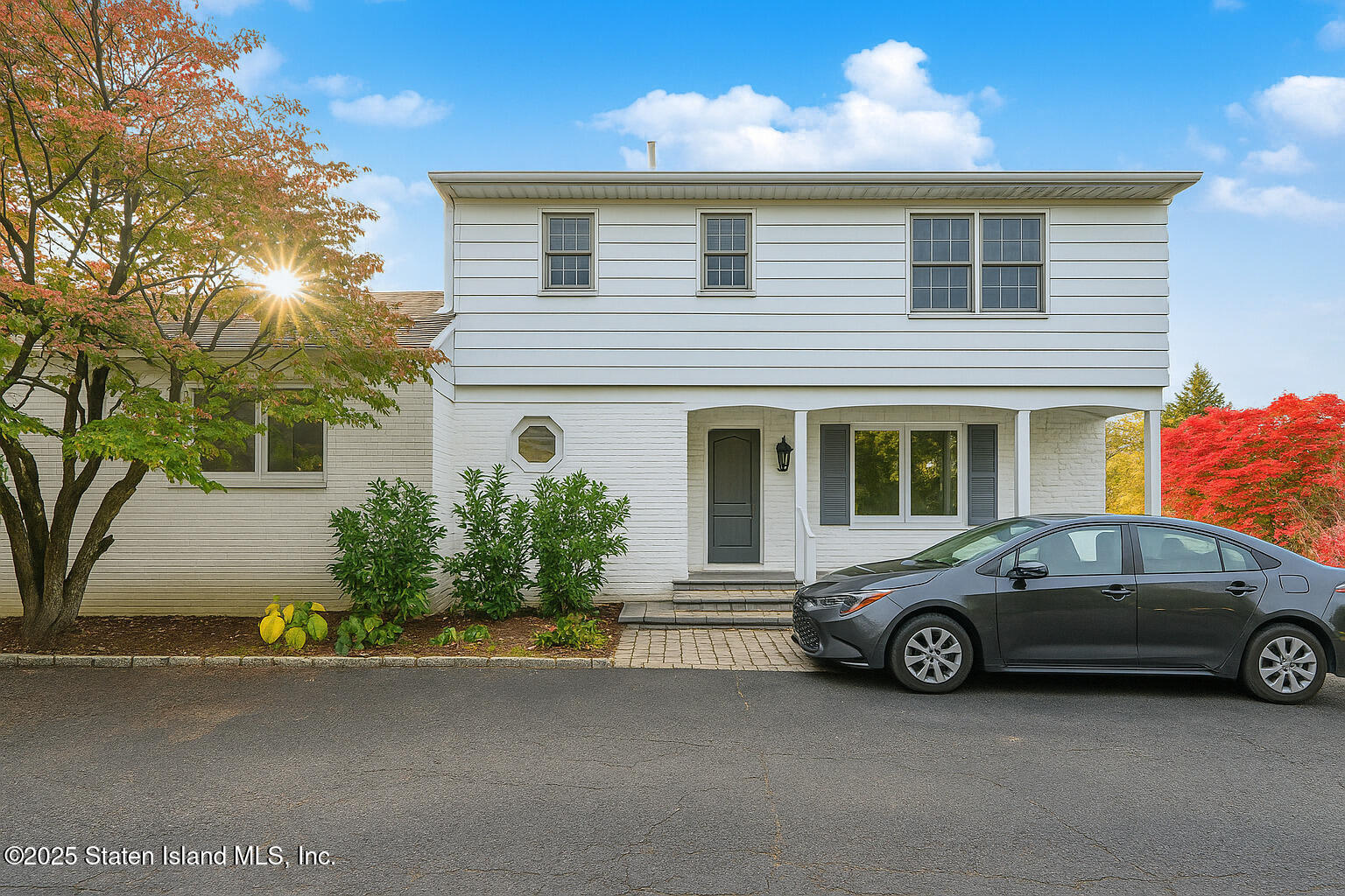 a car parked in front of a house