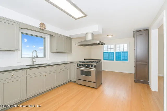 a kitchen with a sink cabinets and appliances