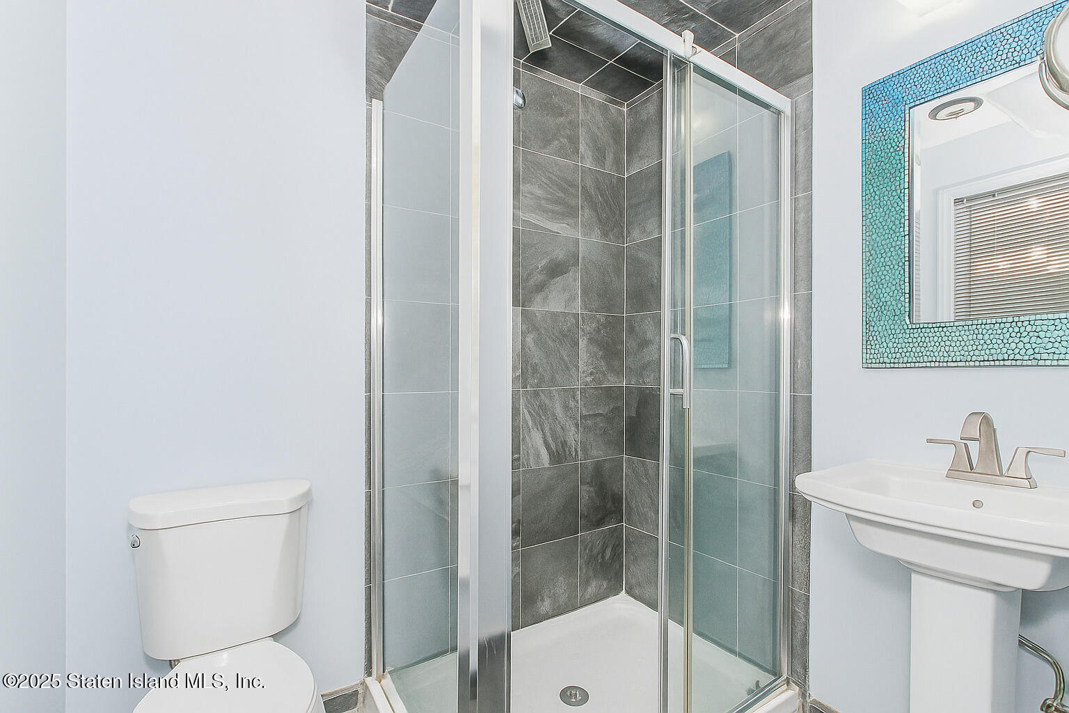 5 Stone Street Staten Island, NY 10304 - Photo 24 of 35 a bathroom with a toilet and a sink