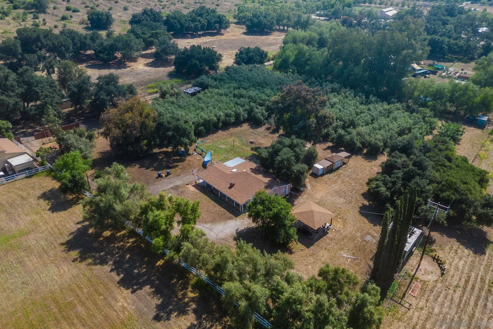 14066 Cool Valley Road Valley Center, CA 92082 - Photo 1 of 34 an aerial view of a house with yard
