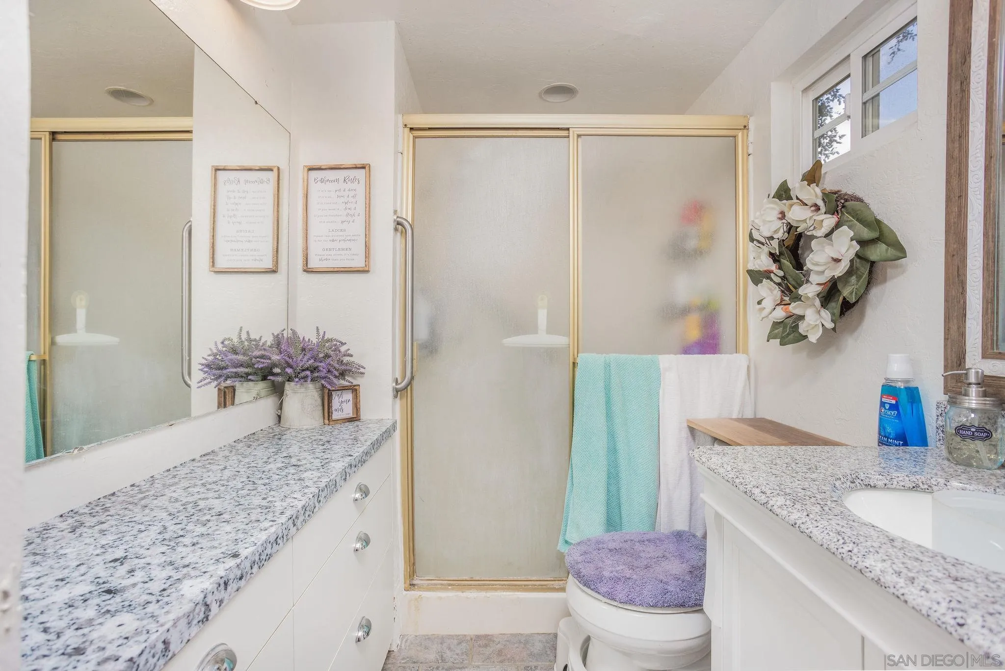 14066 Cool Valley Road Valley Center, CA 92082 - Photo 15 of 34 a bathroom with a granite countertop sink a toilet and shower