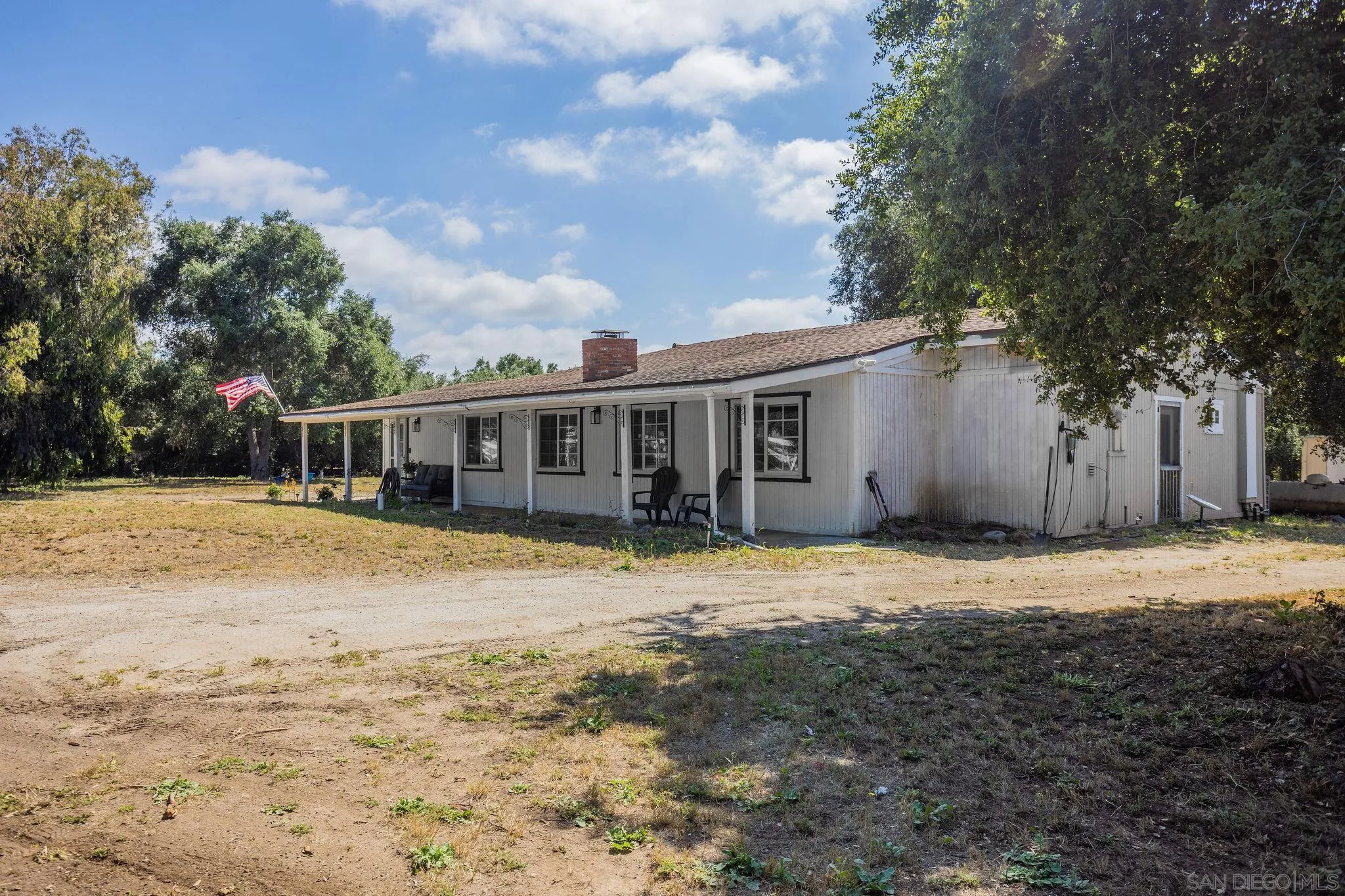 14066 Cool Valley Road Valley Center, CA 92082 - Photo 3 of 34 a front view of a house with a yard