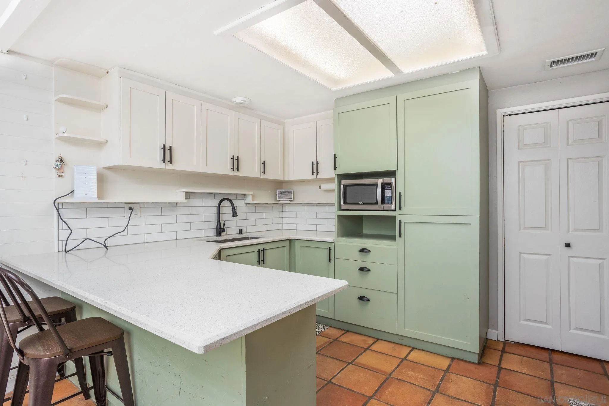 14066 Cool Valley Road Valley Center, CA 92082 - Photo 9 of 34 a kitchen with a sink cabinets and appliances