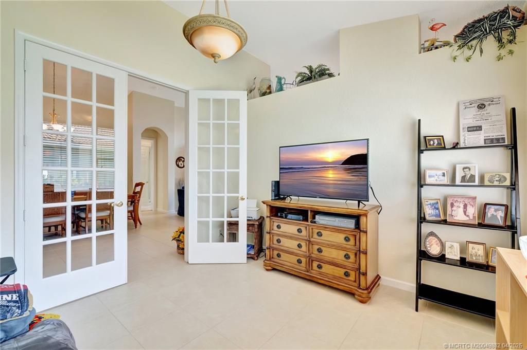 5195 Southeast Graham Drive Stuart, FL 34997 - Photo 11 of 52 a living room with furniture and a flat screen tv