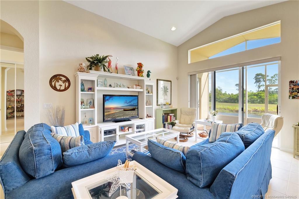 5195 Southeast Graham Drive Stuart, FL 34997 - Photo 12 of 52 a living room with furniture and a flat screen tv