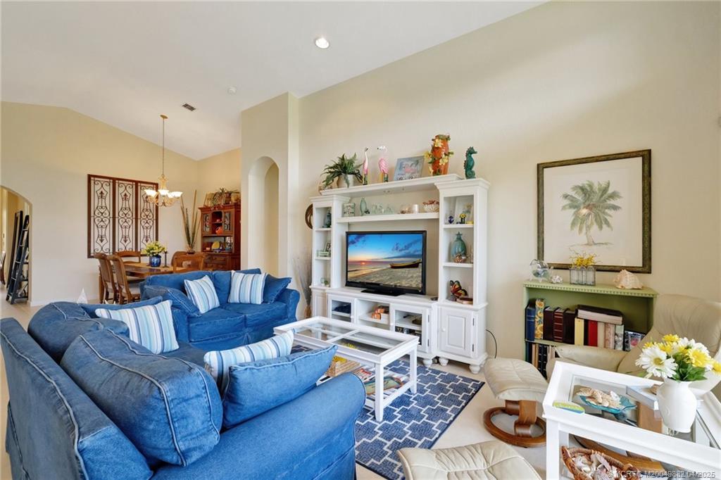 5195 Southeast Graham Drive Stuart, FL 34997 - Photo 13 of 52 a living room with furniture and a flat screen tv