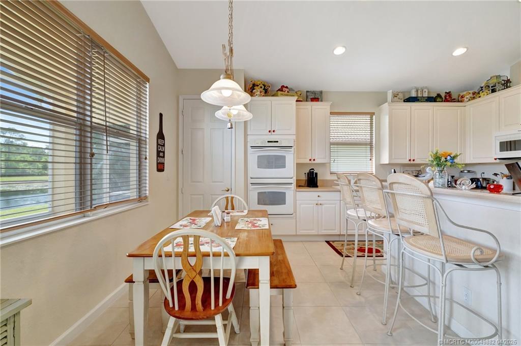 5195 Southeast Graham Drive Stuart, FL 34997 - Photo 15 of 52 a view of a dining room with furniture window and outside view