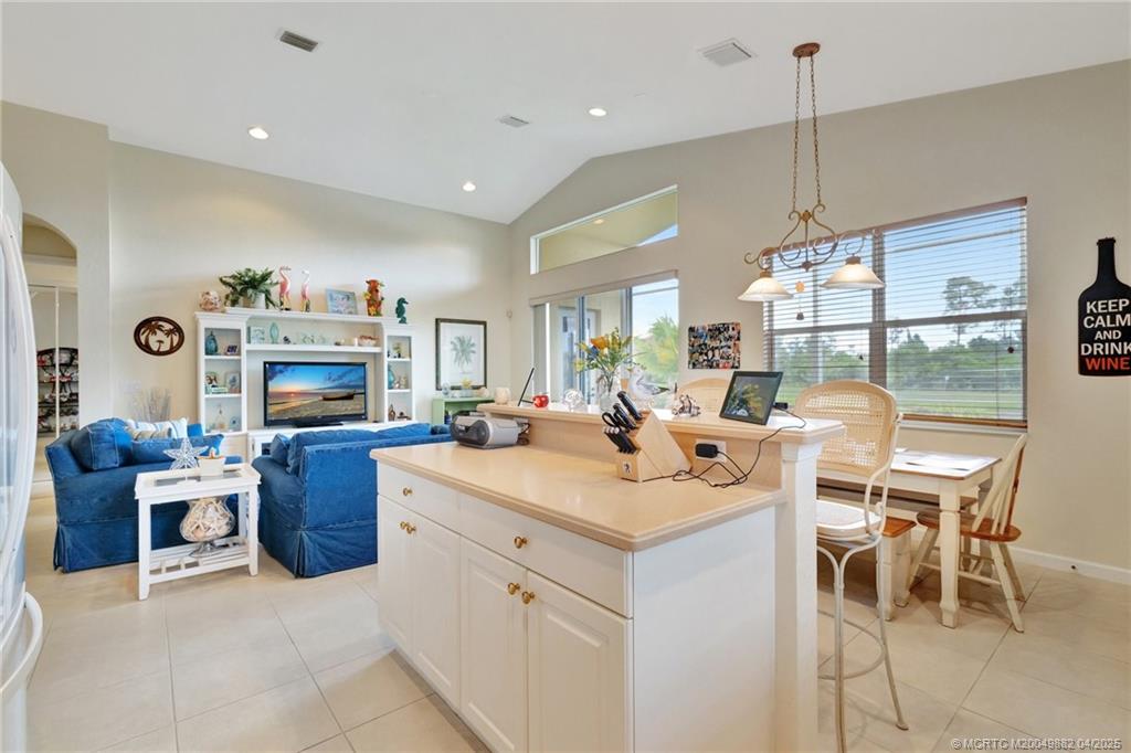5195 Southeast Graham Drive Stuart, FL 34997 - Photo 20 of 52 a kitchen with a sink and a stove top oven