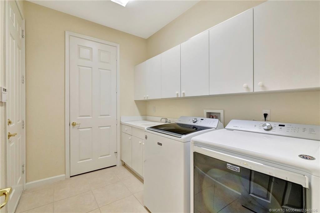 5195 Southeast Graham Drive Stuart, FL 34997 - Photo 33 of 52 a utility room with dryer and washer