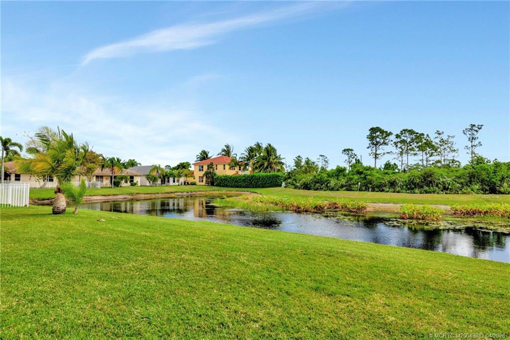 5195 Southeast Graham Drive Stuart, FL 34997 - Photo 40 of 52 a view of a lake with houses in the back