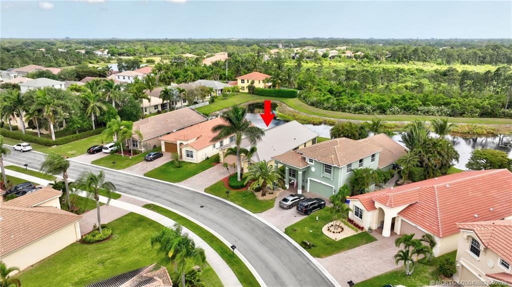5195 Southeast Graham Drive Stuart, FL 34997 - Photo 44 of 52 an aerial view of residential houses with outdoor space and street view