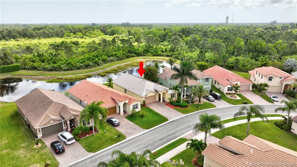 5195 Southeast Graham Drive Stuart, FL 34997 - Photo 45 of 52 an aerial view of residential houses with outdoor space and lake view