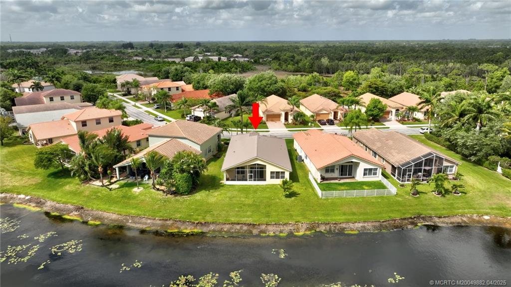 5195 Southeast Graham Drive Stuart, FL 34997 - Photo 47 of 52 an aerial view of house with yard swimming pool and outdoor seating