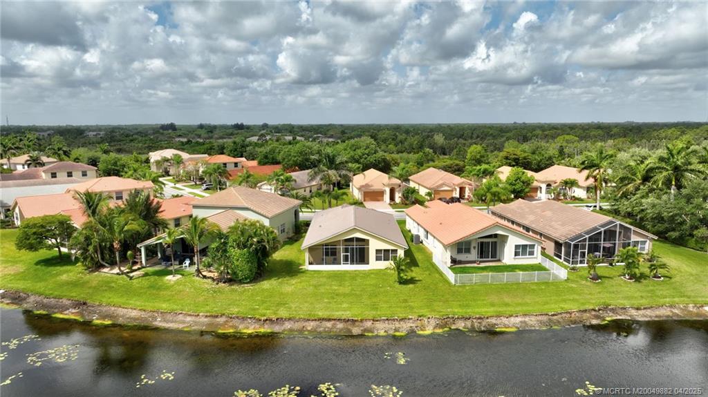 5195 Southeast Graham Drive Stuart, FL 34997 - Photo 49 of 52 a view of houses with swimming pool and outdoor space