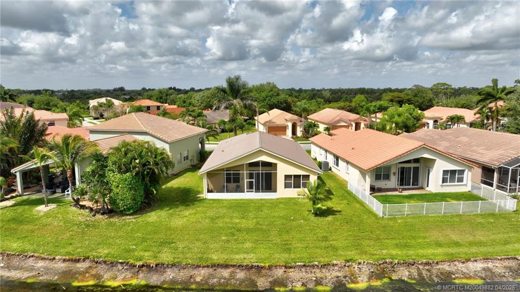 5195 Southeast Graham Drive Stuart, FL 34997 - Photo 50 of 52 a aerial view of a house with a yard