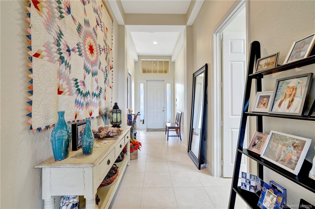 5195 Southeast Graham Drive Stuart, FL 34997 - Photo 5 of 52 a room with lots of stuff and hardwood floor