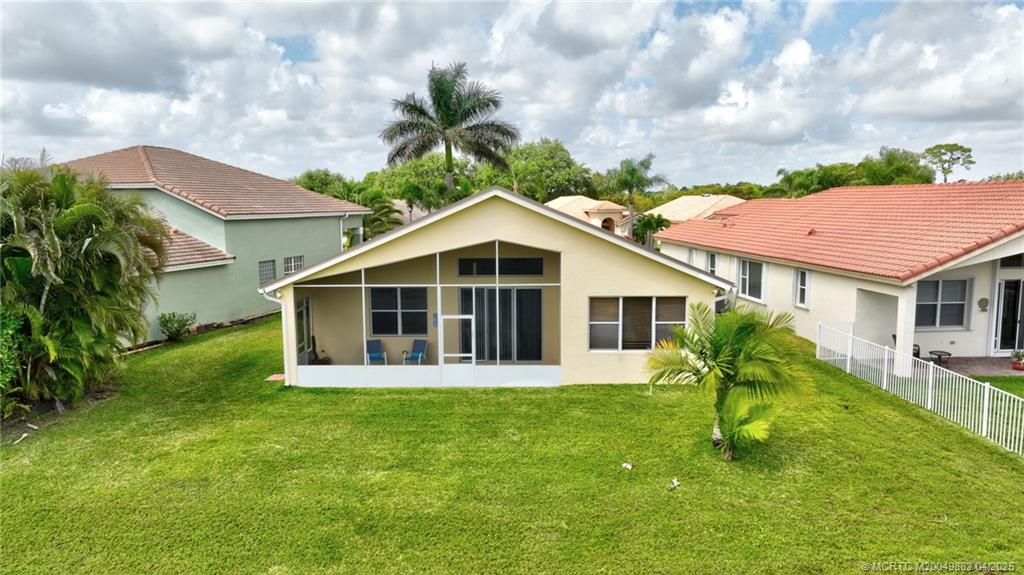 5195 Southeast Graham Drive Stuart, FL 34997 - Photo 51 of 52 a front view of house with yard and green space