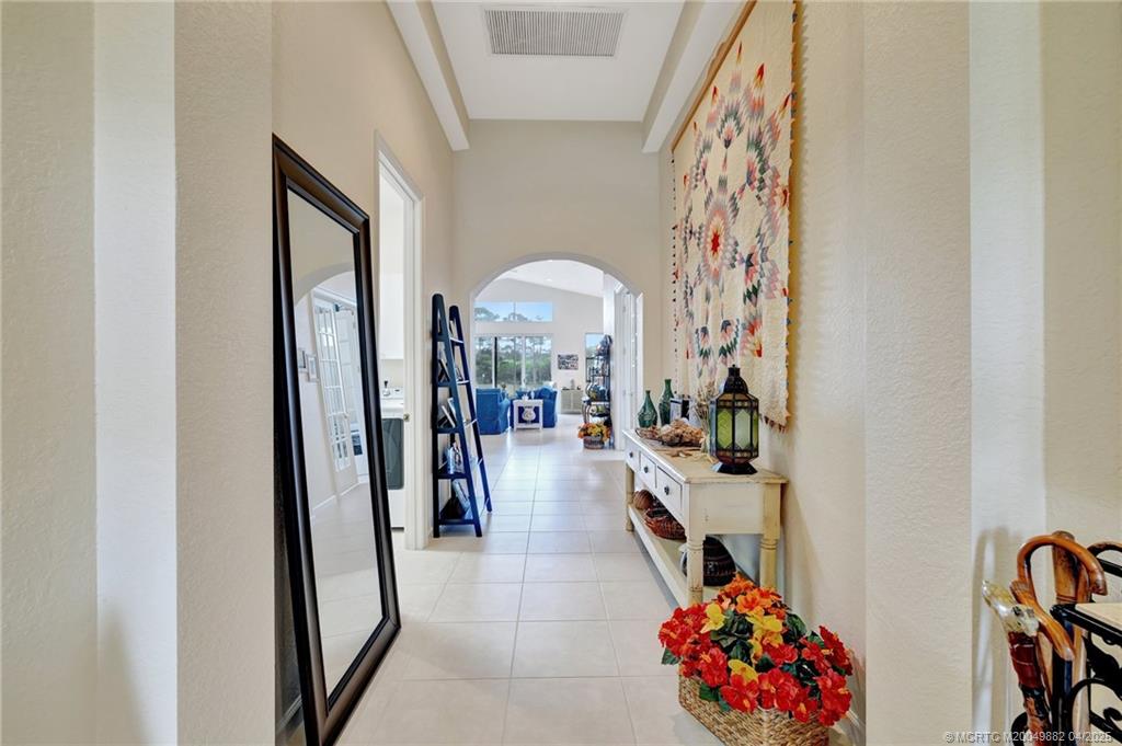 5195 Southeast Graham Drive Stuart, FL 34997 - Photo 6 of 52 a view of a entryway with workspace and living room