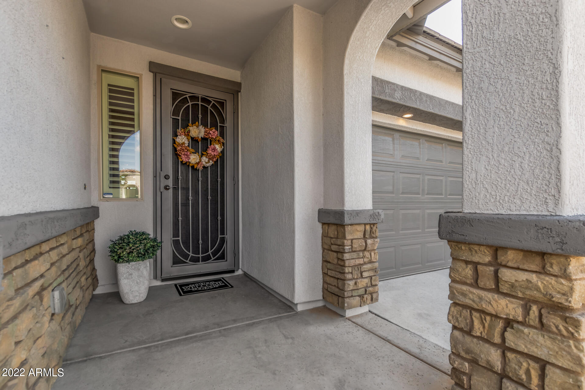 22503 East Calle De Flores Queen Creek, AZ 85142 - Photo 11 of 57 a view of an entryway door and a window