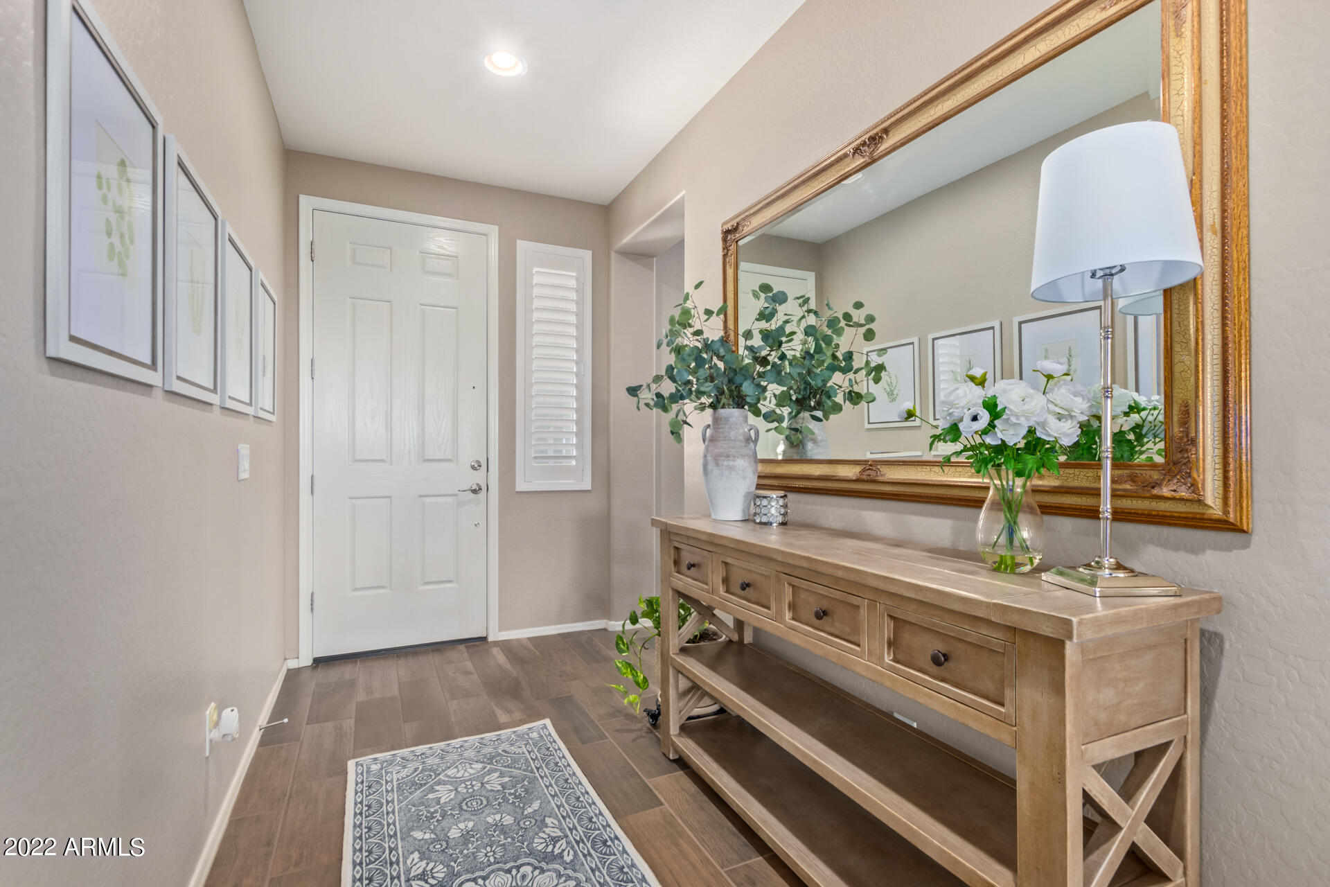 22503 East Calle De Flores Queen Creek, AZ 85142 - Photo 12 of 57 a living room with furniture and a potted plant
