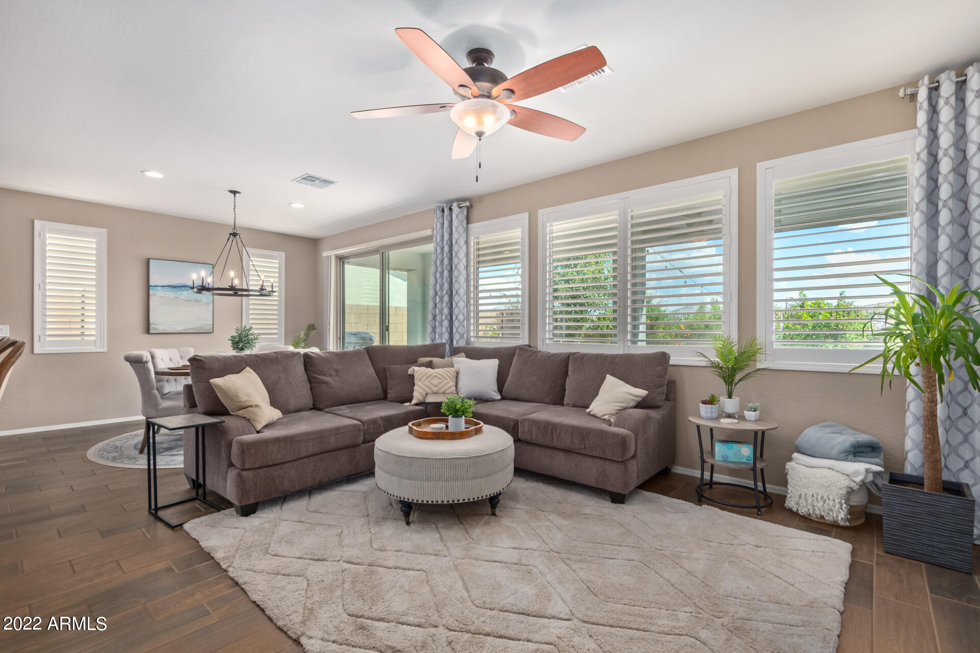 22503 East Calle De Flores Queen Creek, AZ 85142 - Photo 14 of 57 a living room with furniture and a large window with garden view