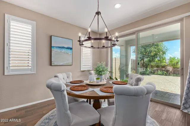 a spacious bathroom with a glass door shower a sink and a mirror