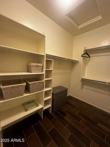 a view of a porch with a table chairs and a yard