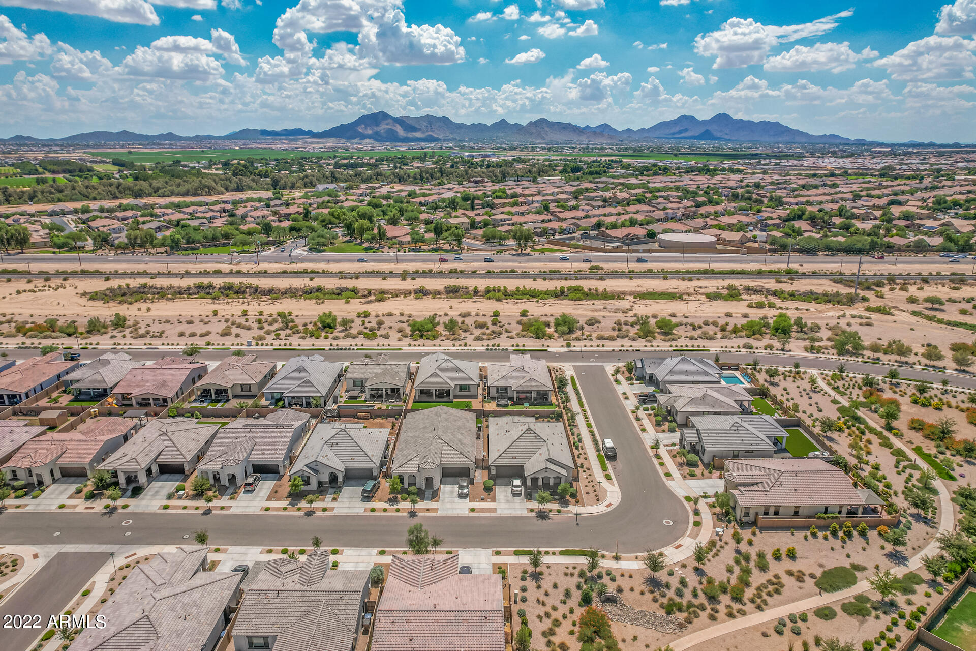 22503 East Calle De Flores Queen Creek, AZ 85142 - Photo 54 of 57 an aerial view of residential houses with outdoor space