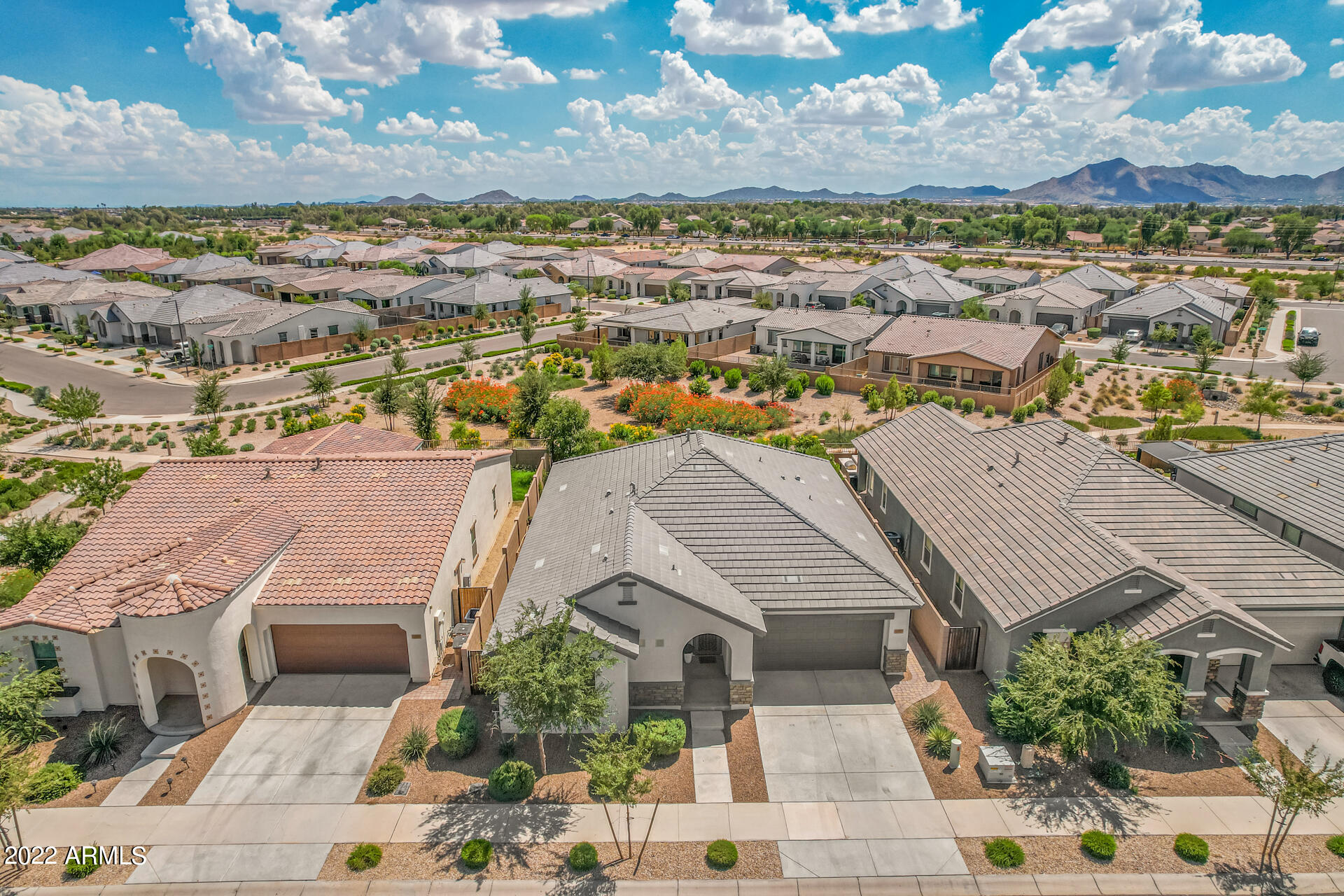 22503 East Calle De Flores Queen Creek, AZ 85142 - Photo 7 of 57 an aerial view of residential houses with outdoor space