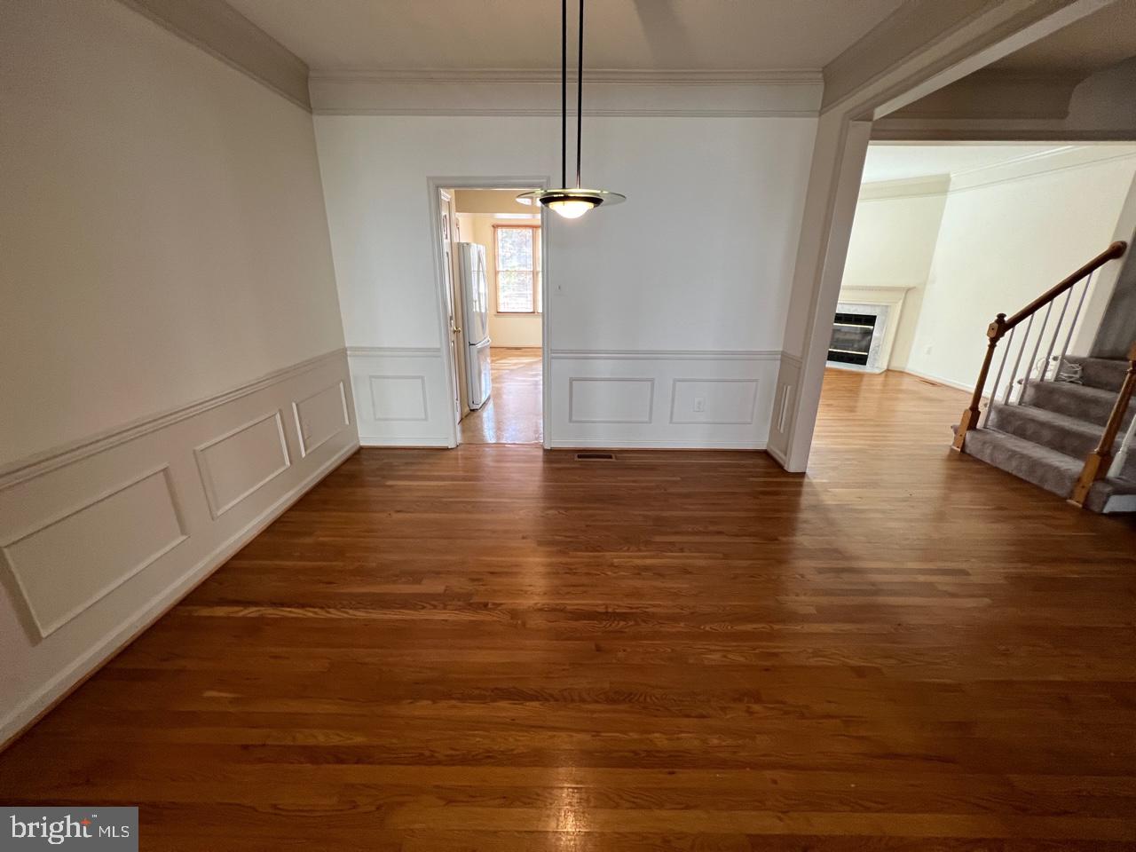 17911 Dumfries Circle Olney, MD 20832 - Photo 12 of 29 a view of a room with wooden floor and staircase