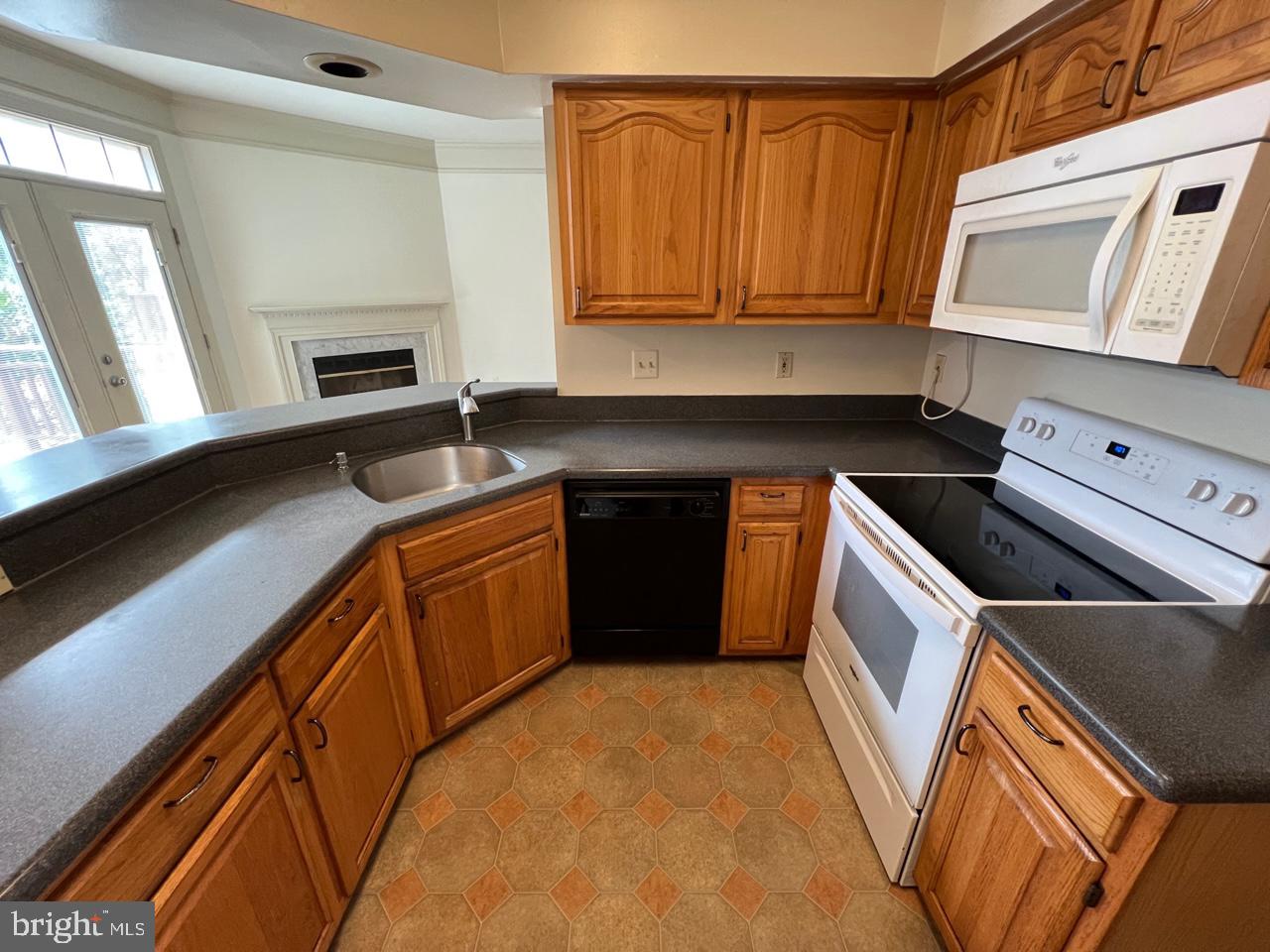 17911 Dumfries Circle Olney, MD 20832 - Photo 2 of 29 a kitchen with a sink a stove and cabinets