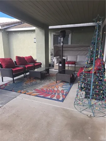 a view of living room filled with furniture and rug