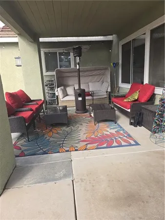 a bedroom with furniture and a chair