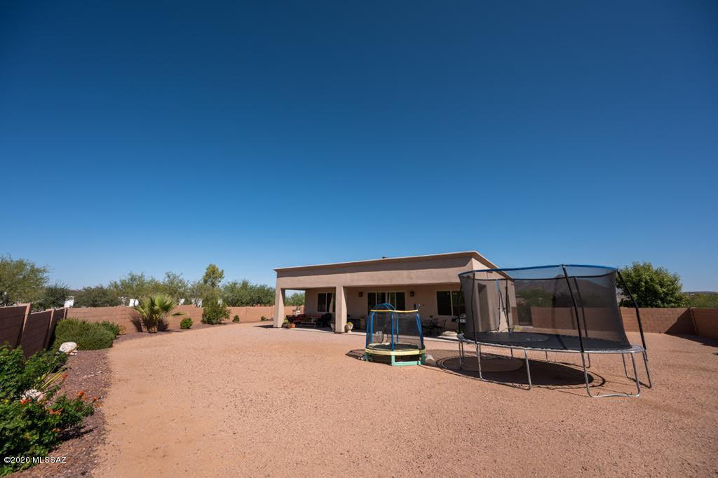 407 Camino Agua Fria Rio Rico, AZ 85648 - Photo 32 of 41 a view of a chairs and tables in the terrace
