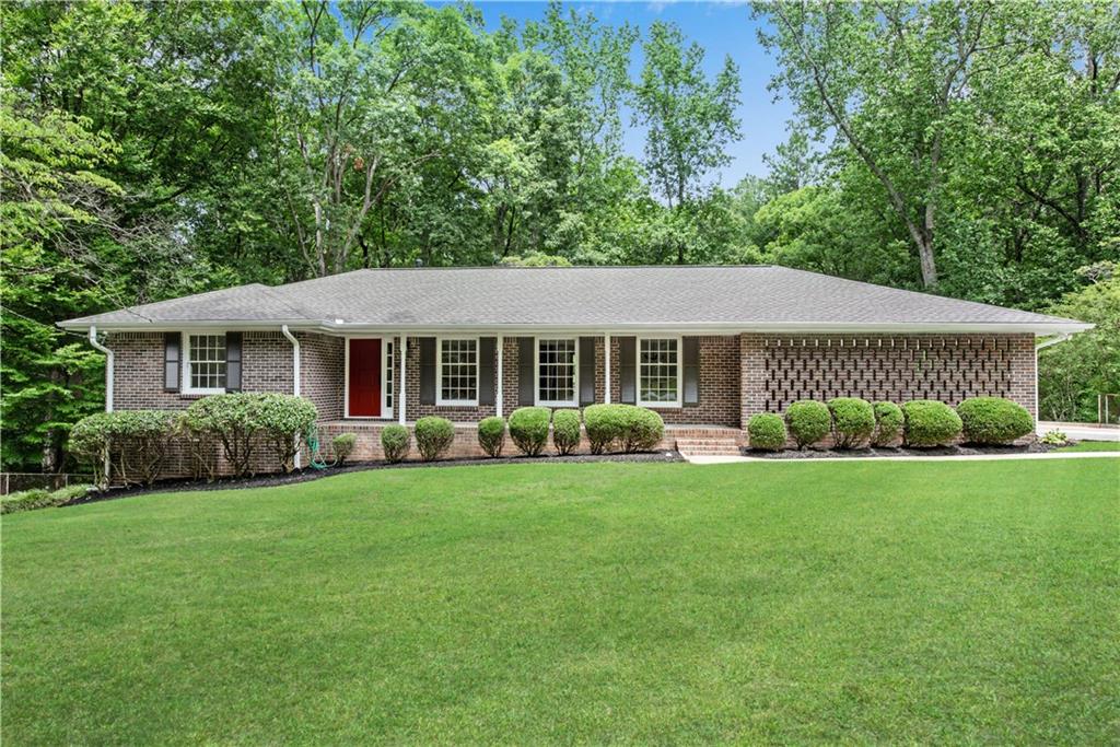 830 Knox Springs Road Austell, GA 30168 - Photo 1 of 1 a front view of a house with a yard