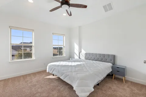 a bedroom with furniture and a window