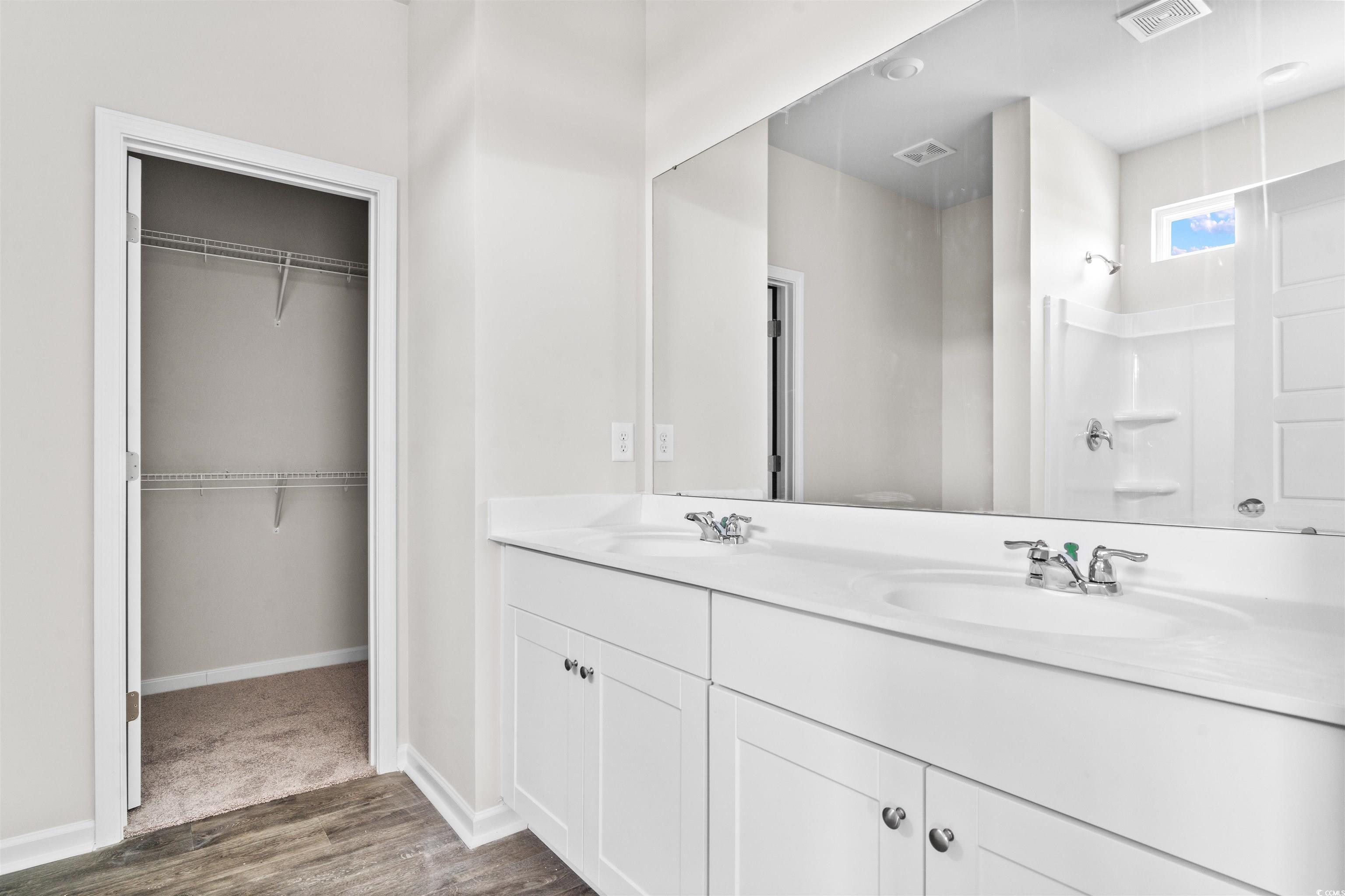 455 Falling Leaf Loop Myrtle Beach, SC 29588 - Photo 13 of 15 Bathroom featuring hardwood / wood-style flooring,