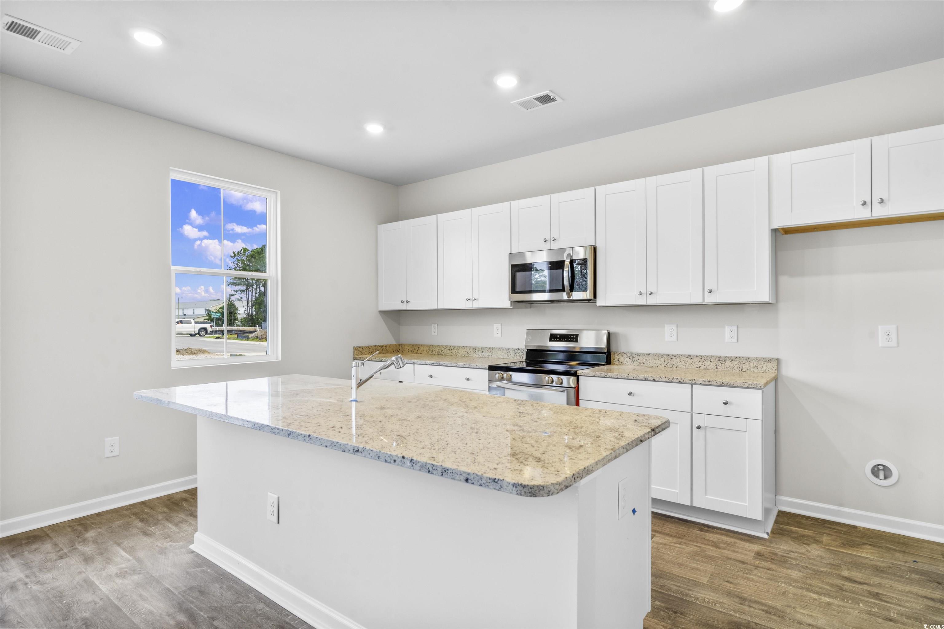 455 Falling Leaf Loop Myrtle Beach, SC 29588 - Photo 7 of 15 Kitchen with stainless steel appliances, an island